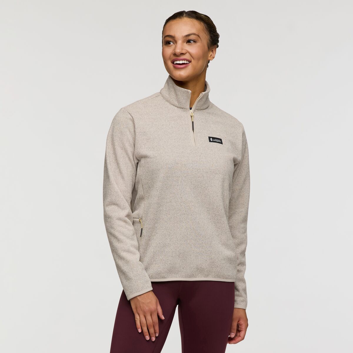 Oatmeal coloured quarter zip recycled fleece from Cotopaxi.