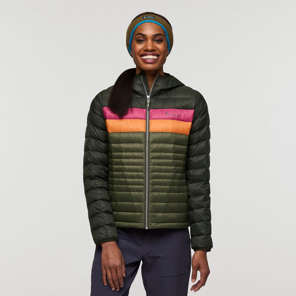 Khaki green responsibly sourced down hooded puffer jacket by Cotopaxi, with orange and pink stripes.