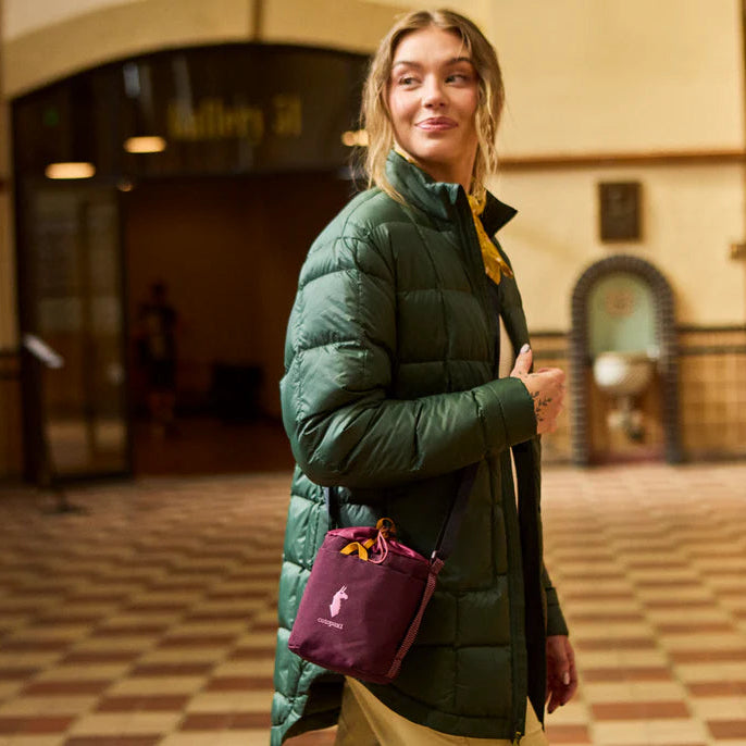 Deep green responsibly sourced down puffer jacket by Cotopaxi.