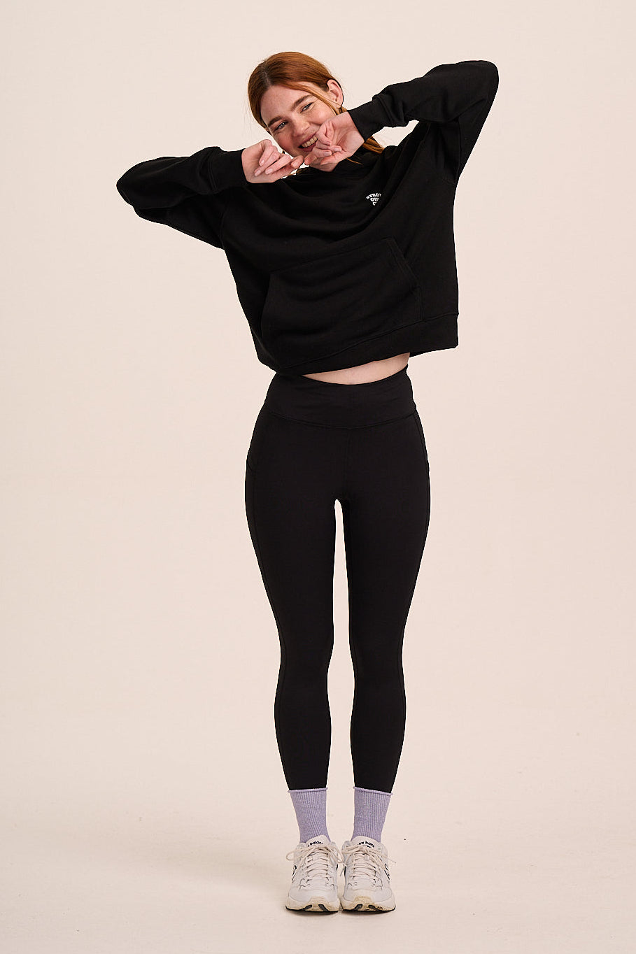 Black high-waisted leggings with fitted silhouette, full-length design, and stretchy fabric.