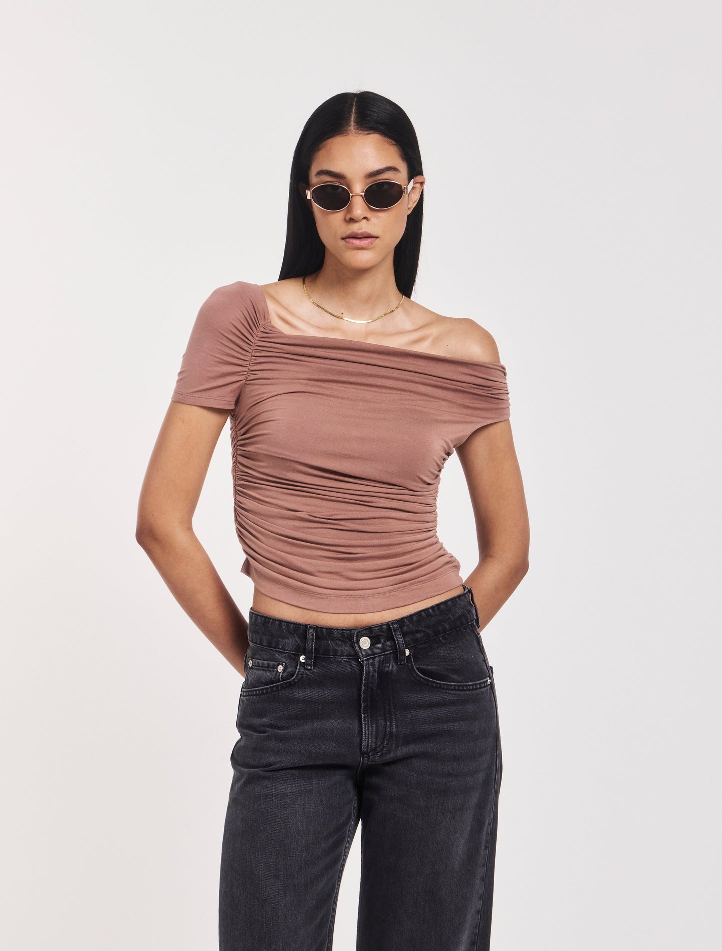 Off-the-shoulder ruched micromodal top in dusky sandalwood brown.