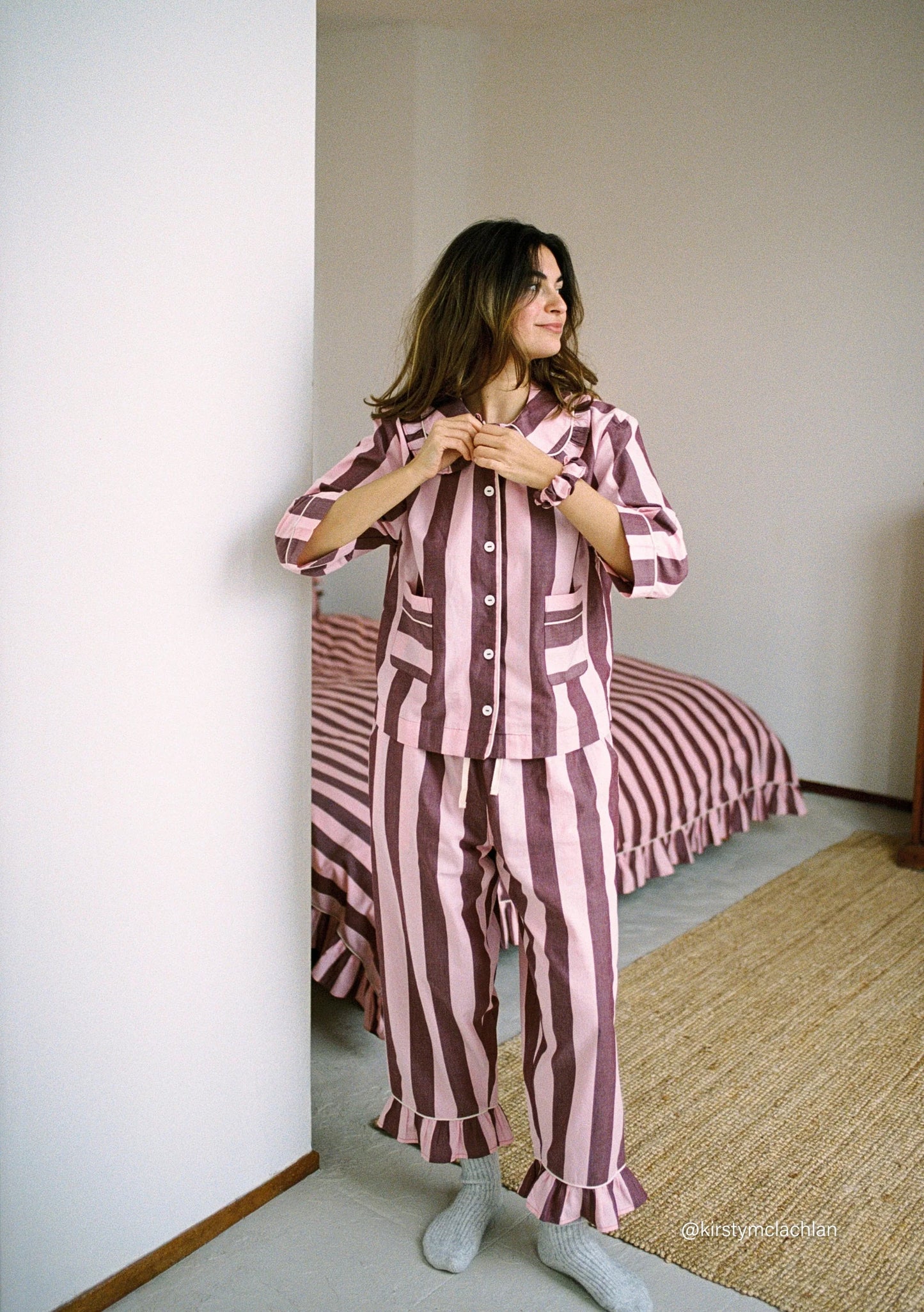 Burgundy and lilac striped cropped organic cotton pyjamas with ruffle detail at collar and cuffs, by TBCo.