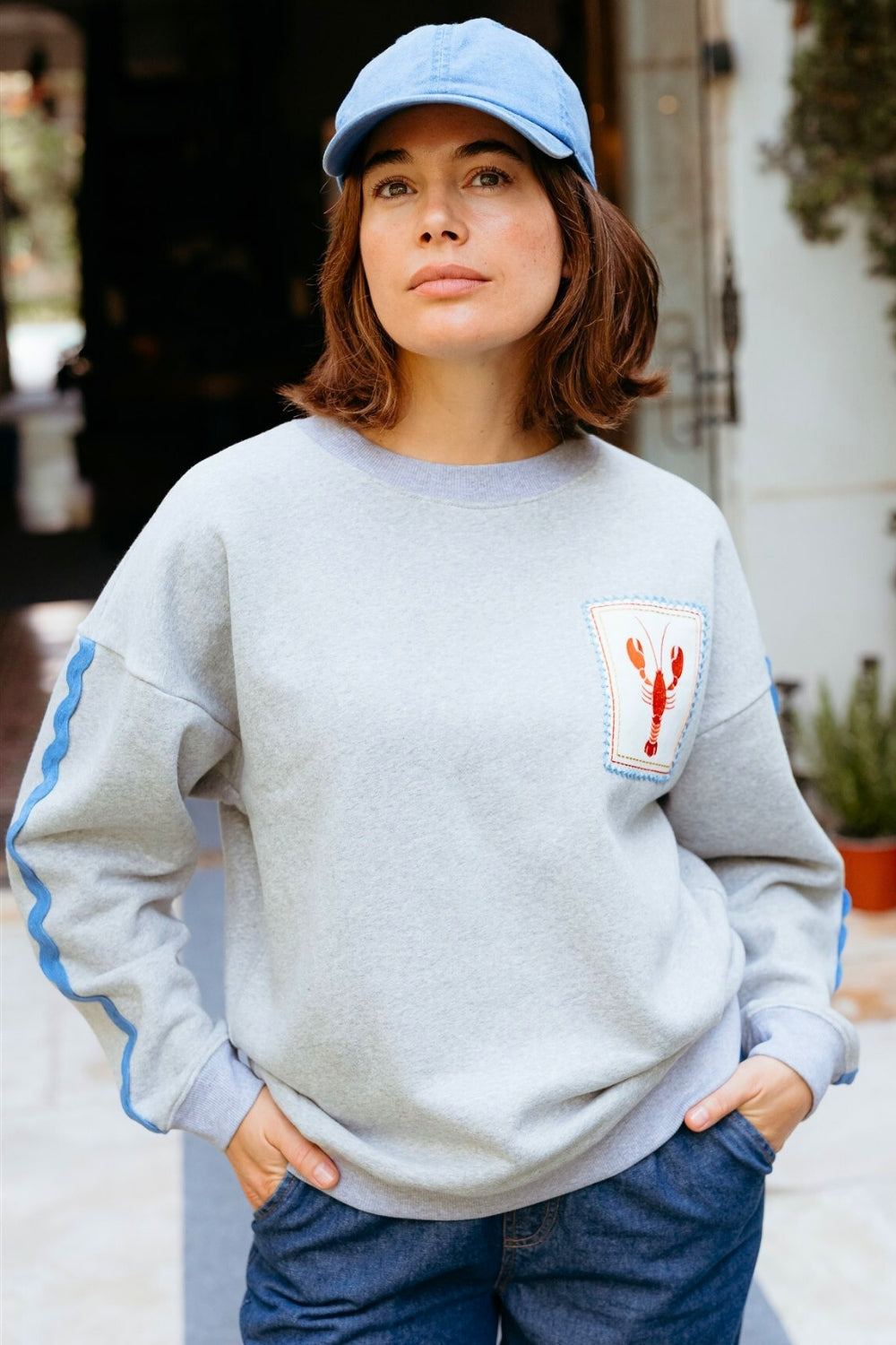 Grey marl Sugarhill Brighton 100% cotton sweatshirt with blue piping and red lobster motif.