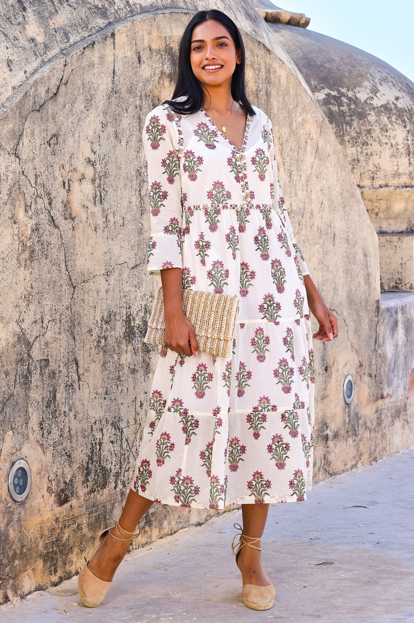 Block print summer midi dress with pink flowers on creamy white background.