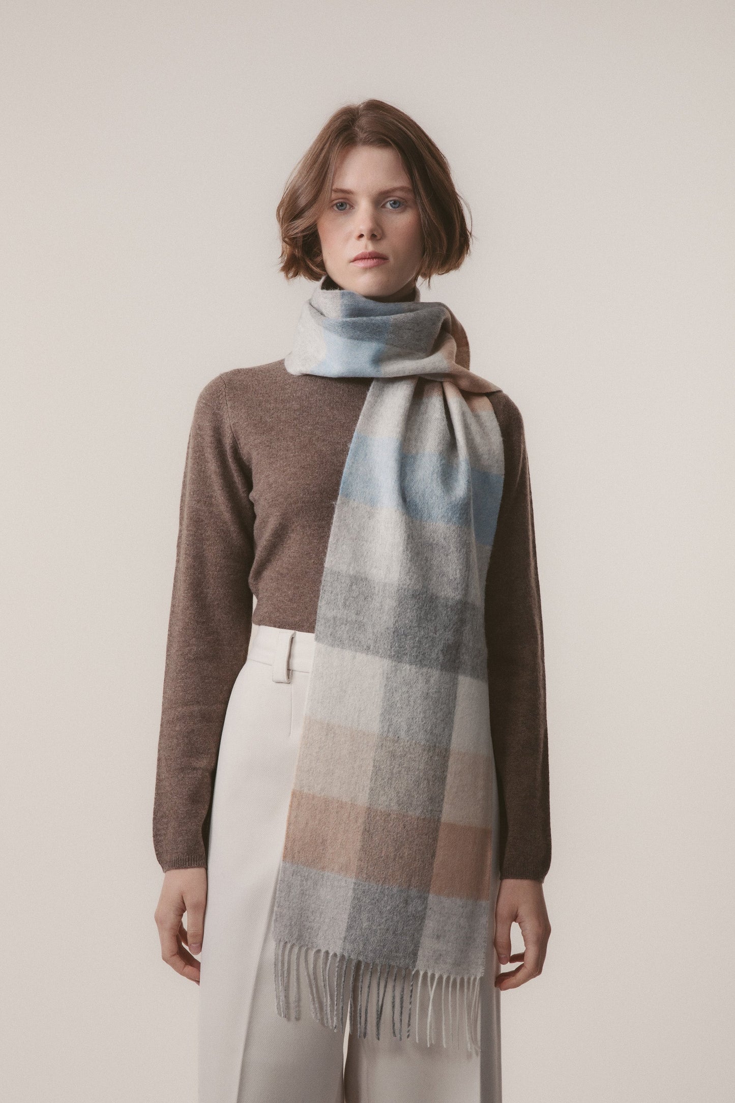Soft blue, grey, and beige checked lambswool scarf by Kiltane.