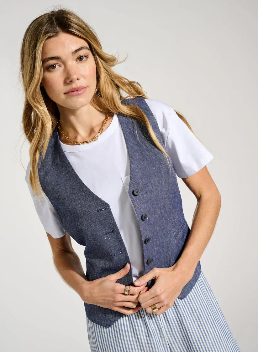 Denim vest and white T-shirt as Summer neutrals.