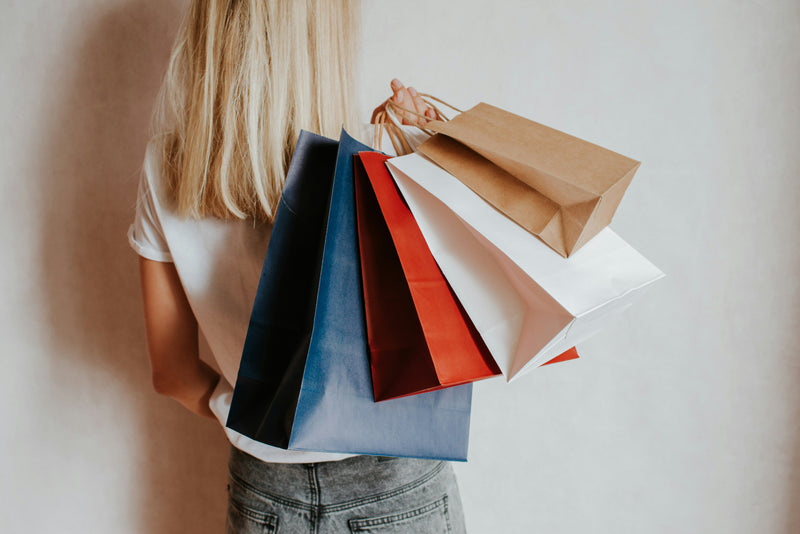 Photo of woman holding shopping bags.  