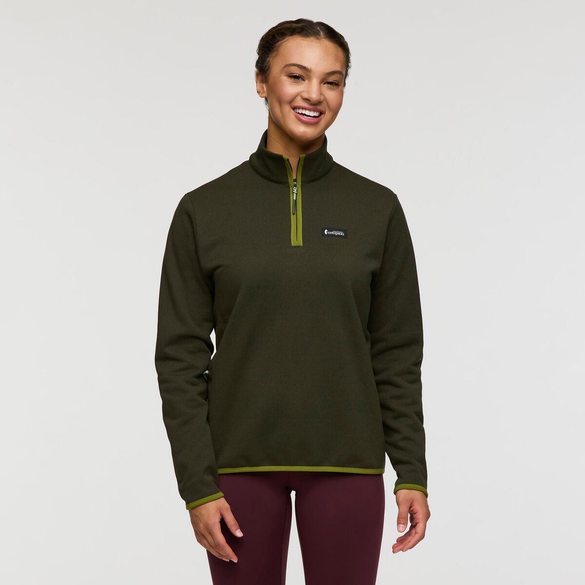 Forest green recycled polyester fleece by Cotopaxi.