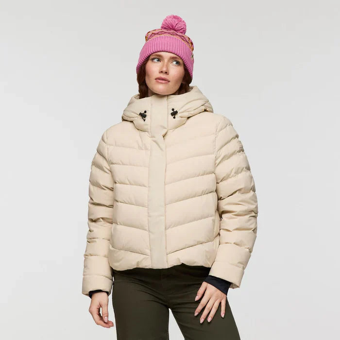 Cream responsibly sourced down puffer jacket by Cotopaxi.