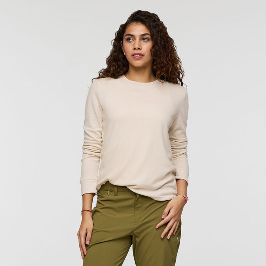 Cream long sleeved baselayer shirt by Cotopaxi.