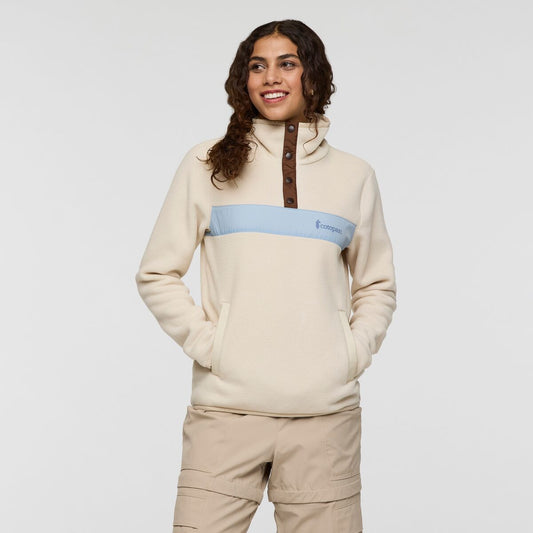 Light cream fleece with chocolate button detail and light blue Cotopaxi logo stripe.