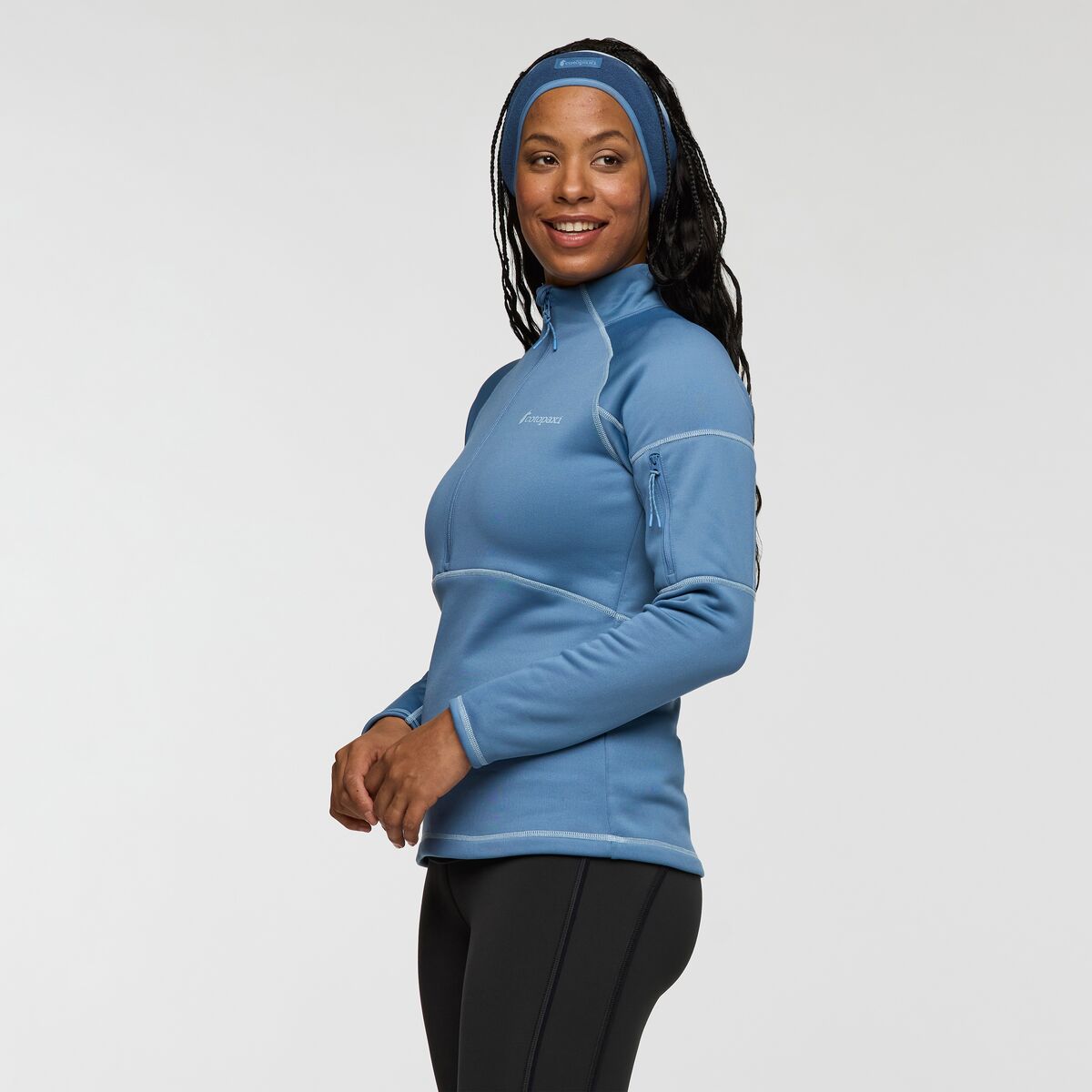 Light blue half zip recycled polyester fleece by Cotopaxi.