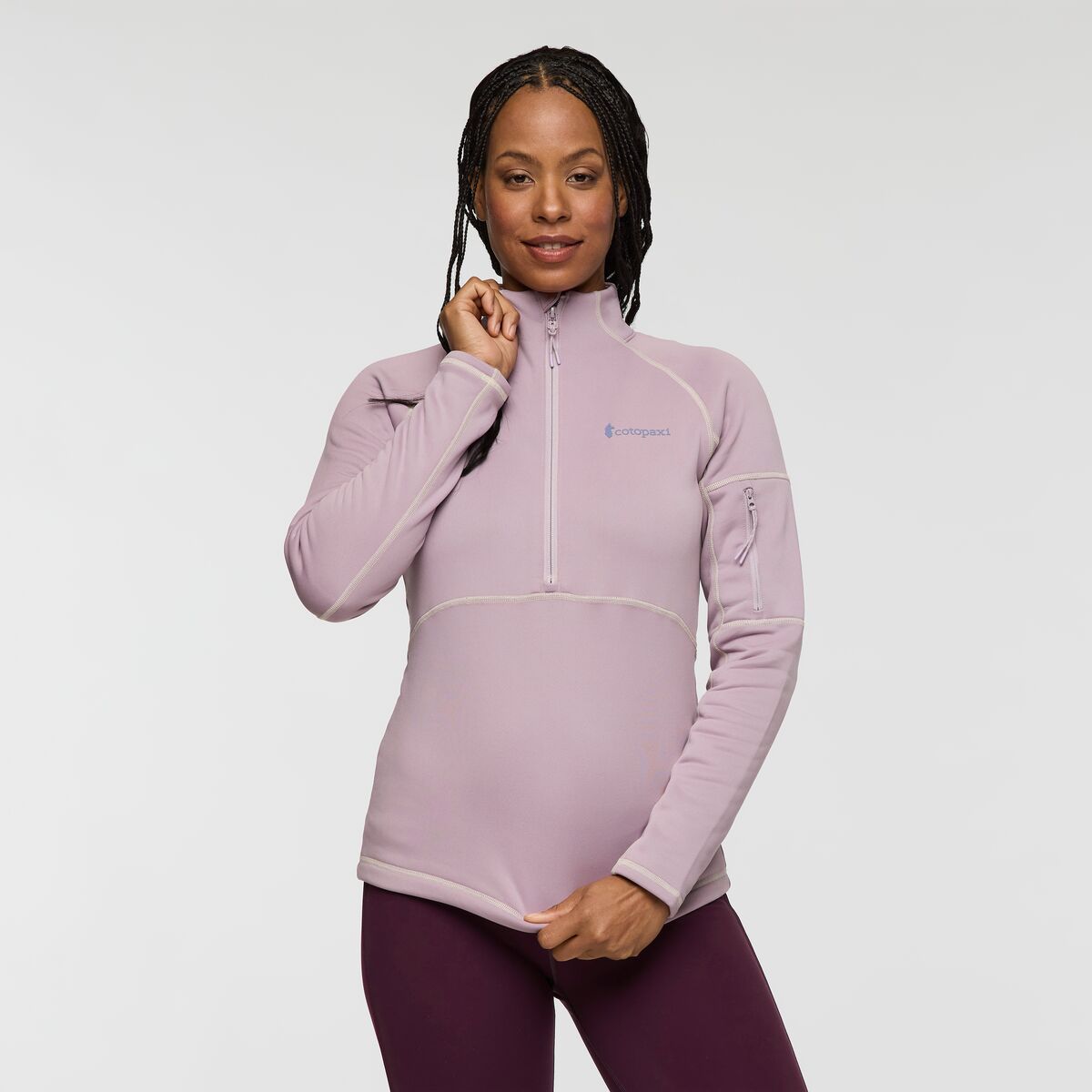 Soft greyed lilac recycled polyester half zip fleece with Cotopaxi logo.