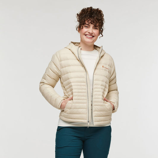 Soft cream responsibly sourced down puffer jacket with hood by Cotopaxi.