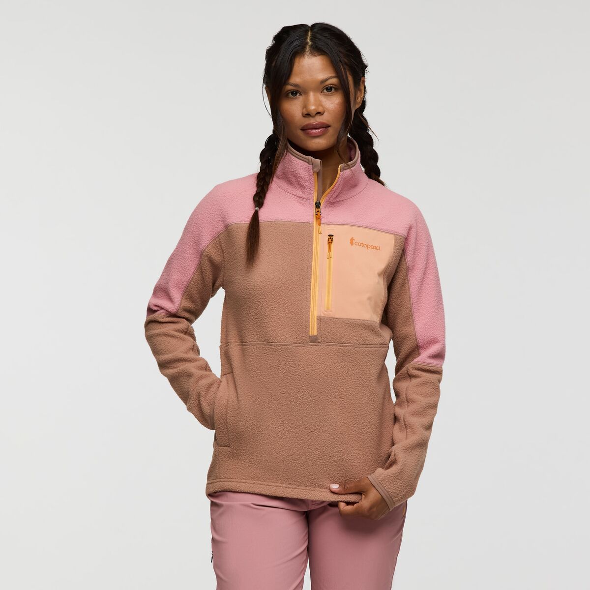 Blush pink and soft brown half zip fleece from Cotopaxi.