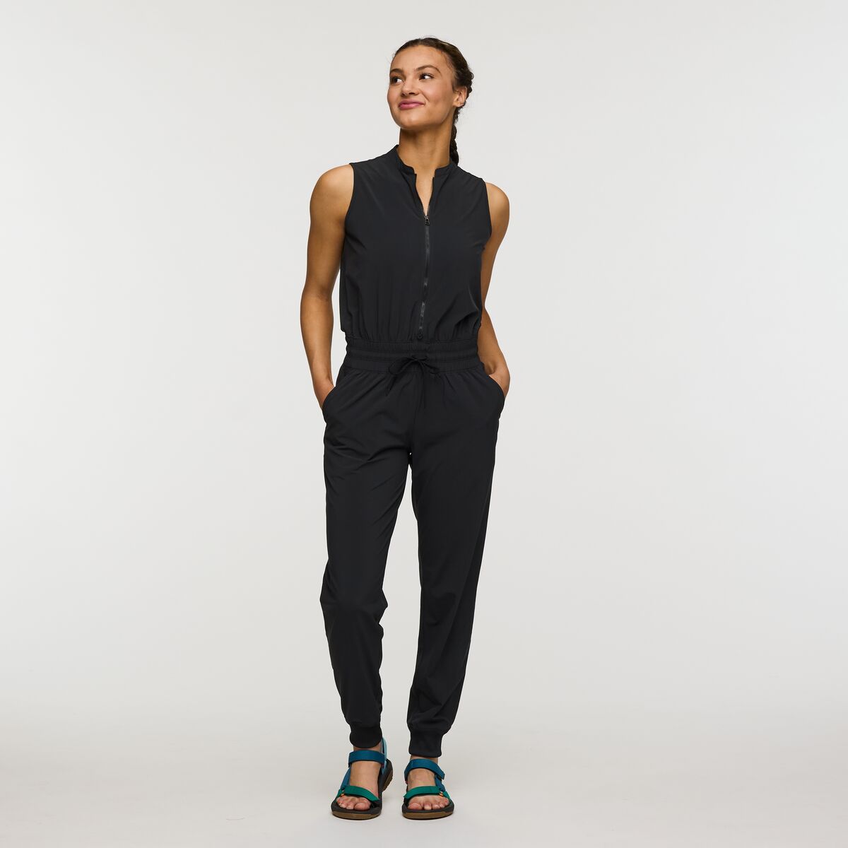 Black recycled polyester UV jumpsuit by Cotopaxi.