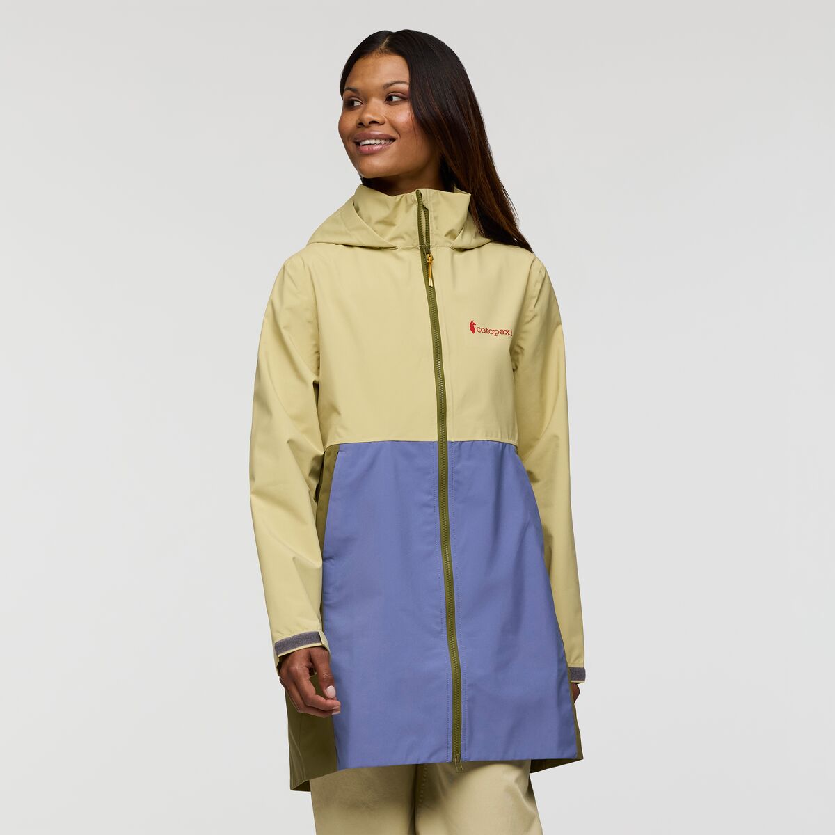Butter yellow and soft periwinkle blue rain coat by Cotopaxi.