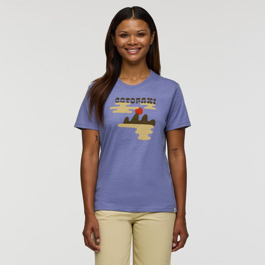 A soft sky blue T-shirt with Cotopaxi and sunrise image graphic on the front in cream, red, and brown.