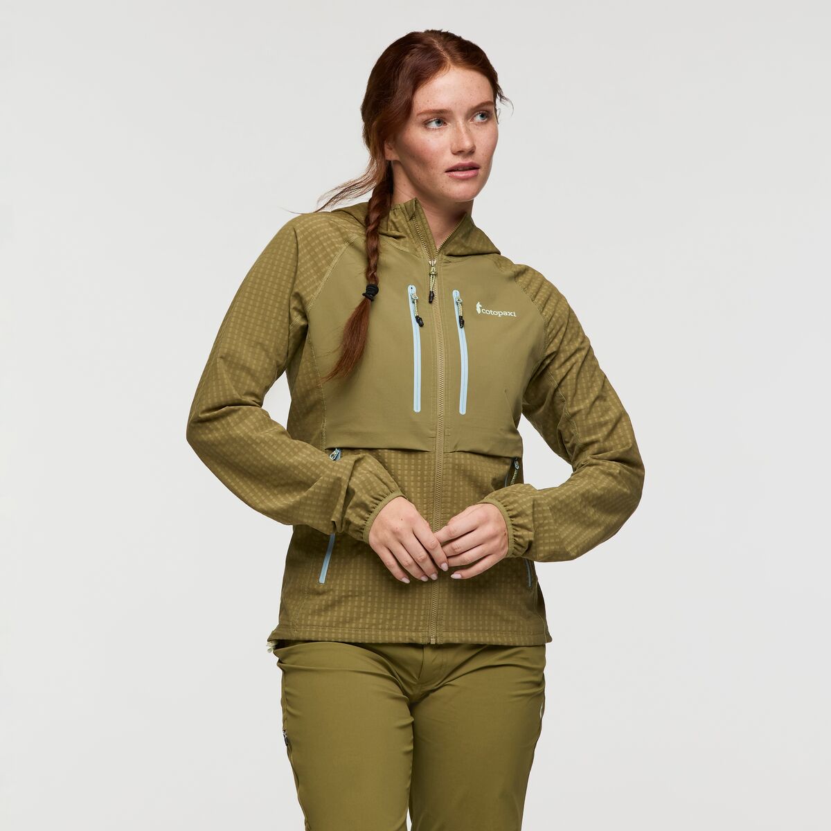 Olive green hooded jacket by Cotopaxi.