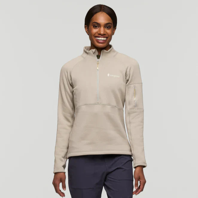 Beige half zip fleece pullover by Cotopaxi.