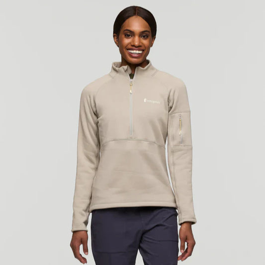 Beige half zip fleece pullover by Cotopaxi.
