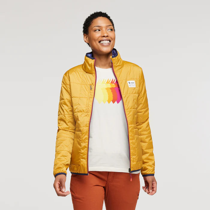 Golden yellow reversible recycled puffer jacket by Cotopaxi.