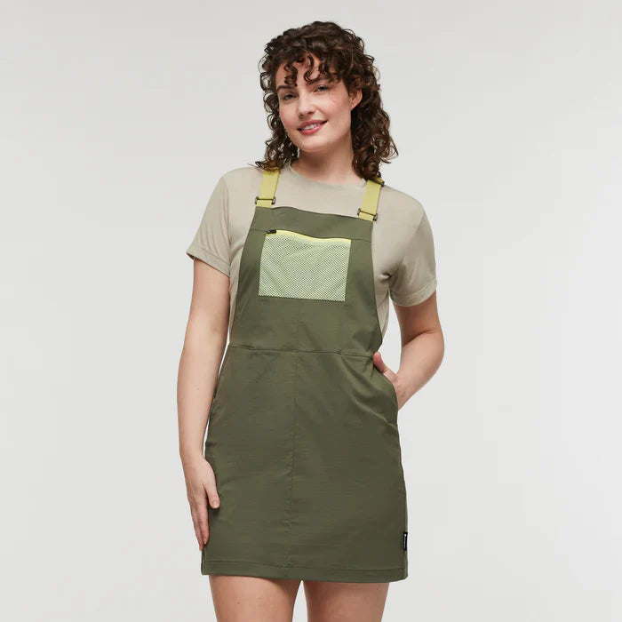 Olive green pinafore UPF 50 hiking dress with yellow straps and mesh pocket, by Cotopaxi.