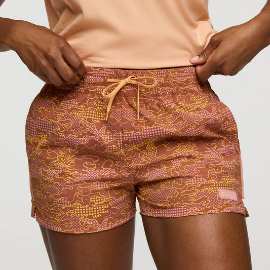 Soft terracotta orange and yellow patterned shorts by Cotopaxi.