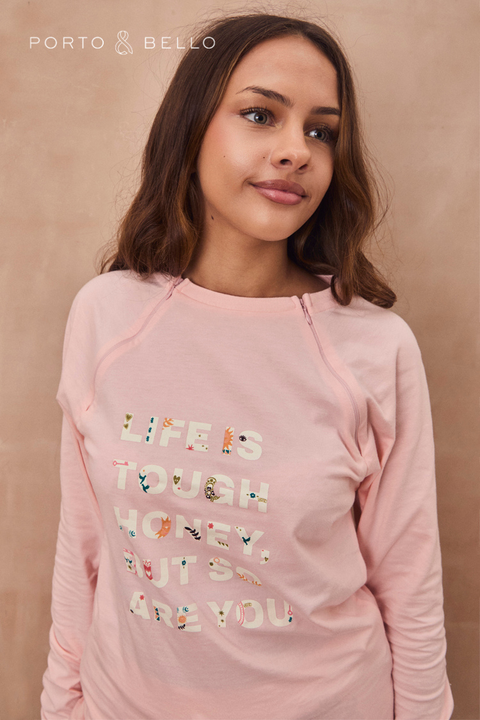 Pale pink long-sleeved accessible t-shirt with slogan "Life is tough honey, but so are you".