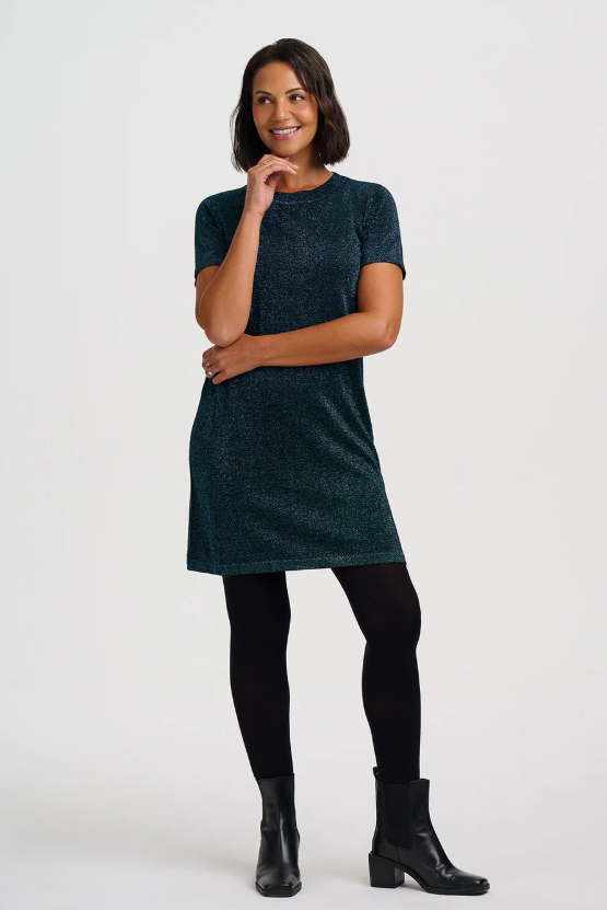 Teal sparkle mini dress worn with black tights and ankle boots.