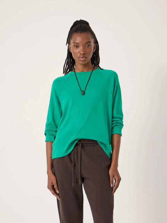 Bright green raglan top.