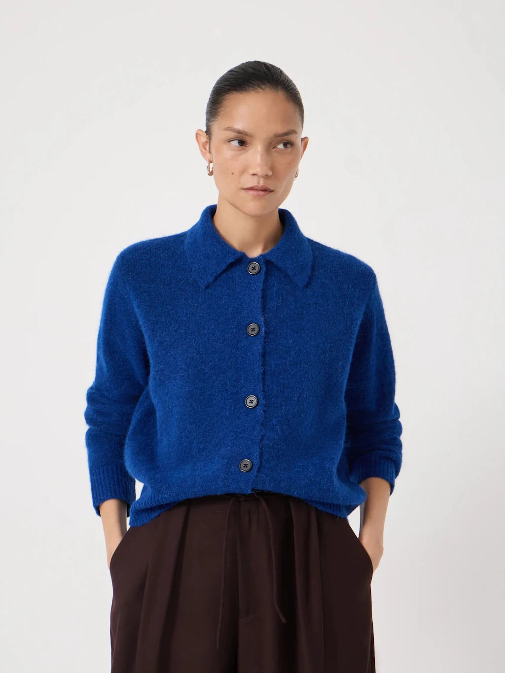 Deep blue cardigan with collar.