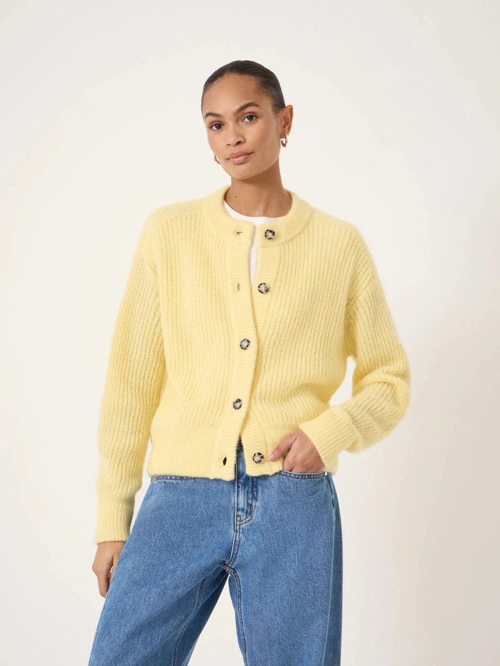 Butter yellow cable knit cardigan.