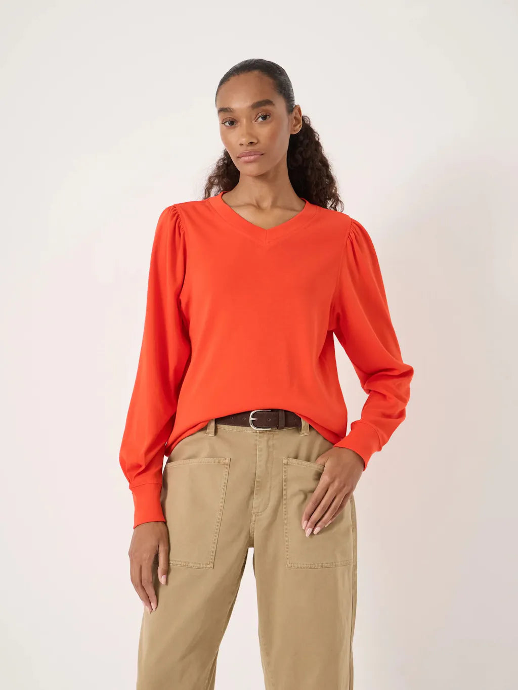 Orange cotton puff sleeve v neck top.