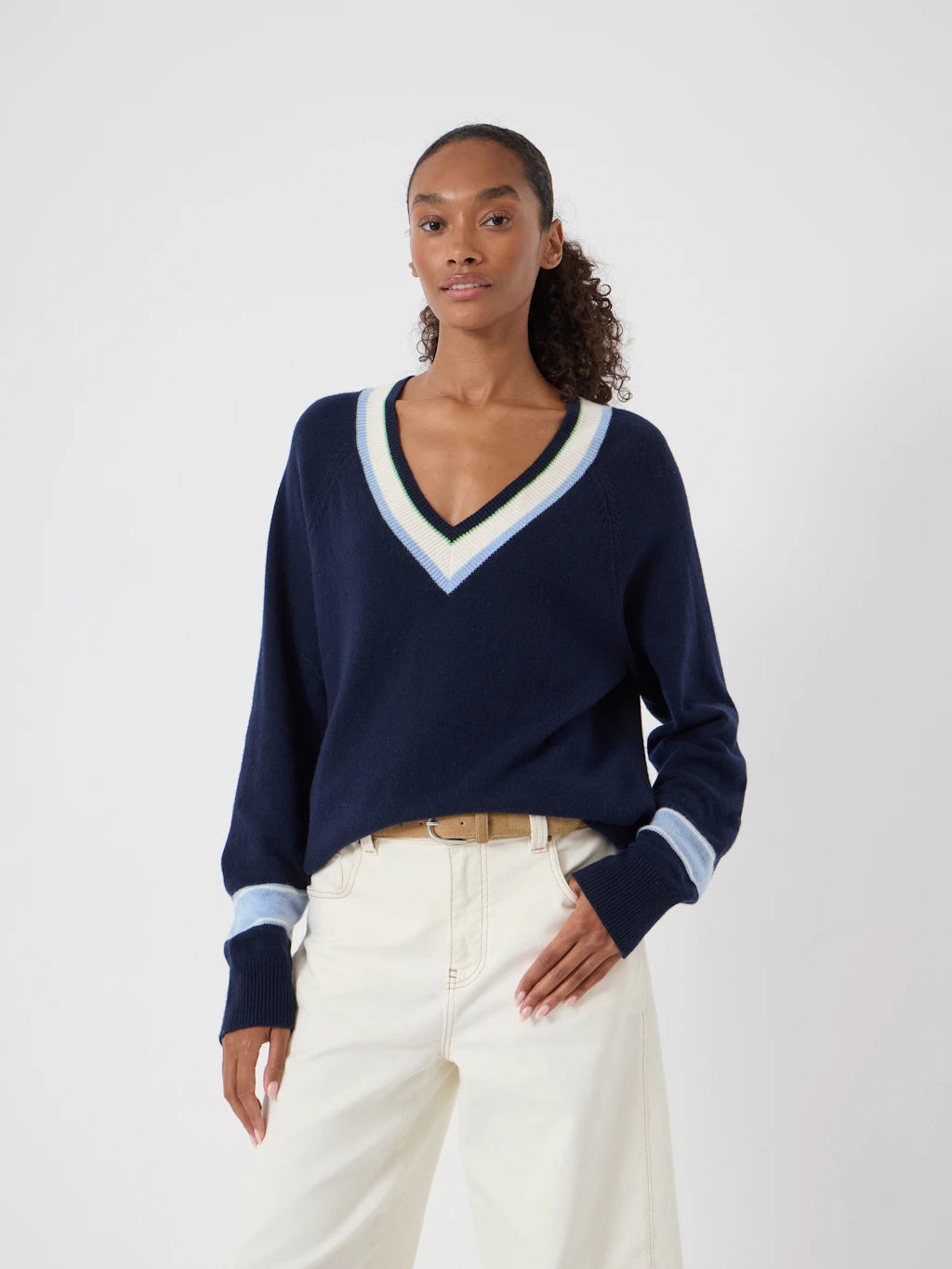 Navy blue wide neck pullover with cream stripe detail at collar and cuffs.