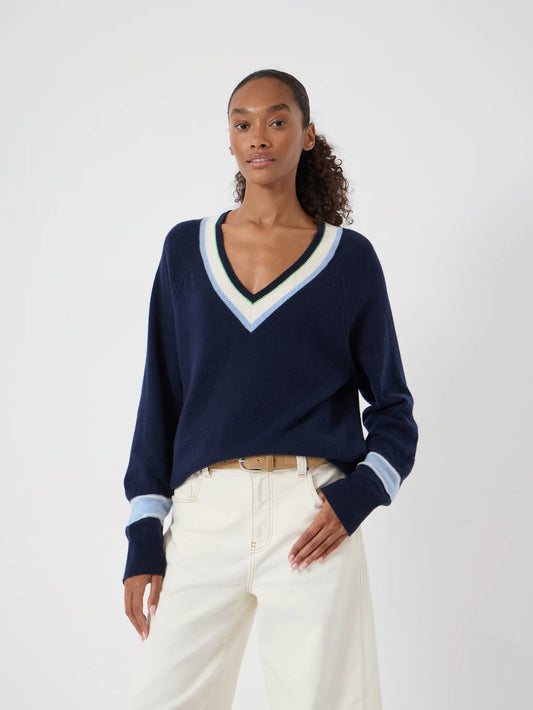 Navy blue wide neck pullover with cream stripe detail at collar and cuffs.