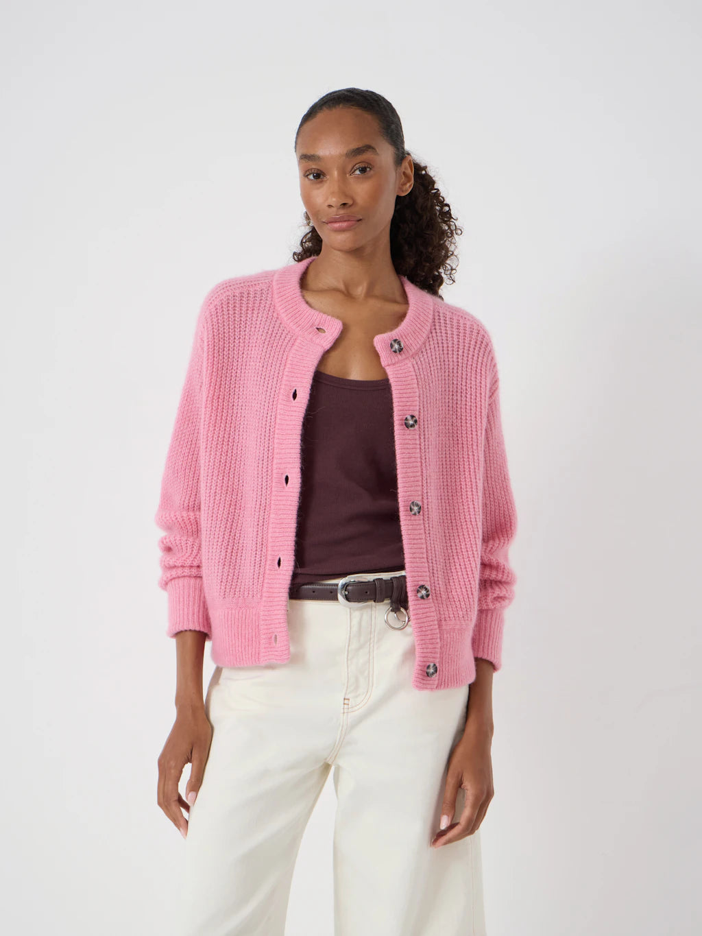 Candy pink cable knit cardigan.