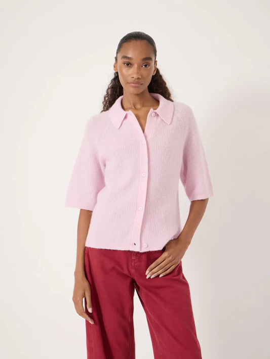 Light pink short-sleeve knitted cardigan with a collar, button front, and soft textured finish.