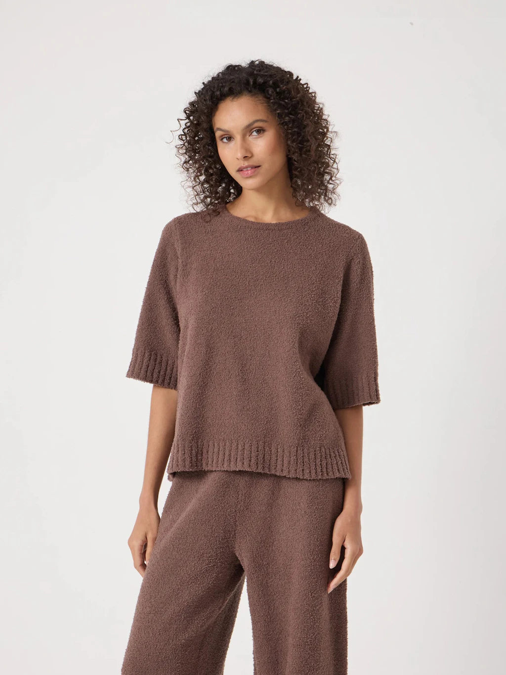 Warm brown boucle knit short-sleeve top.