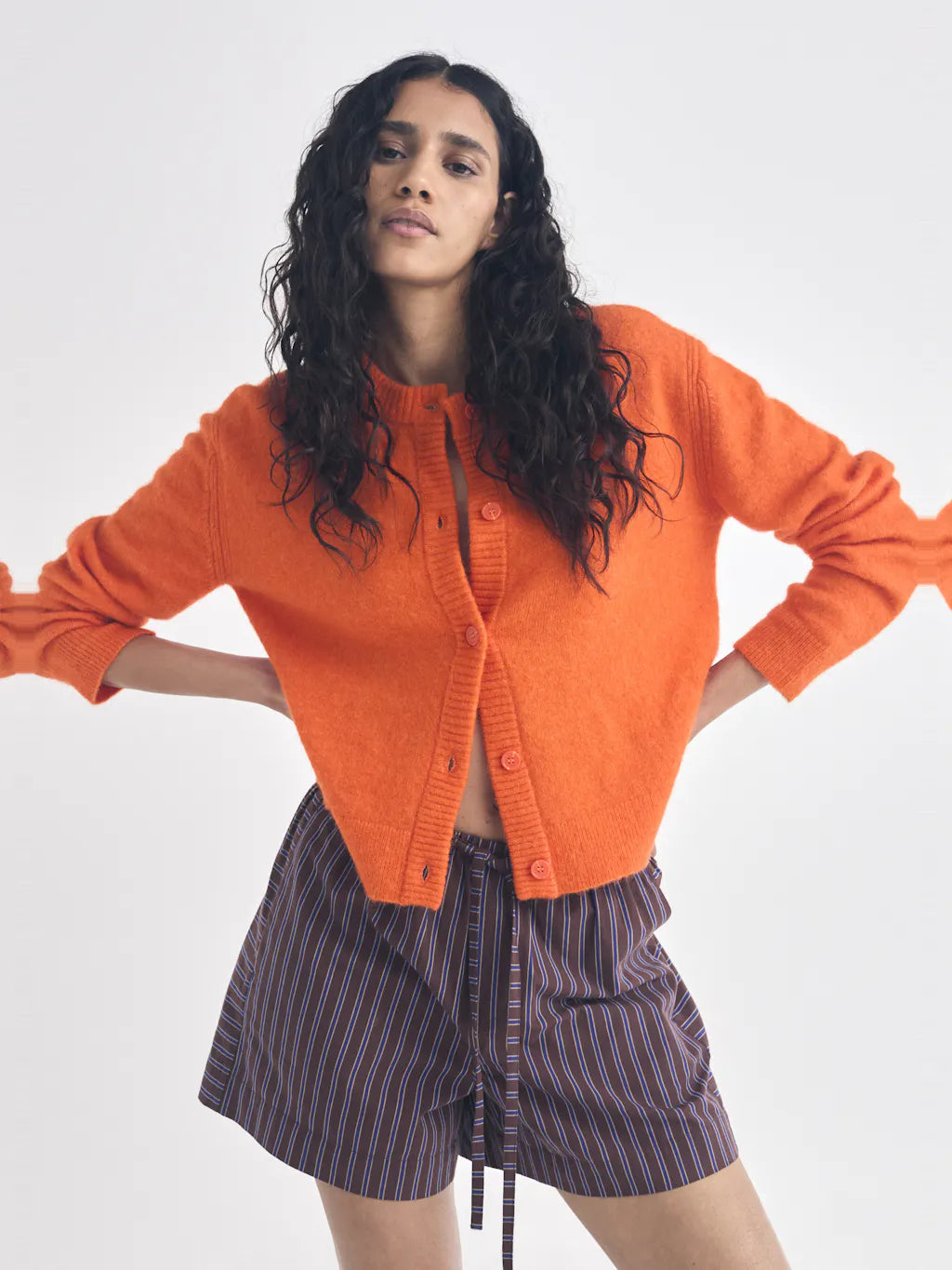 Bright orange alpaca cardigan.