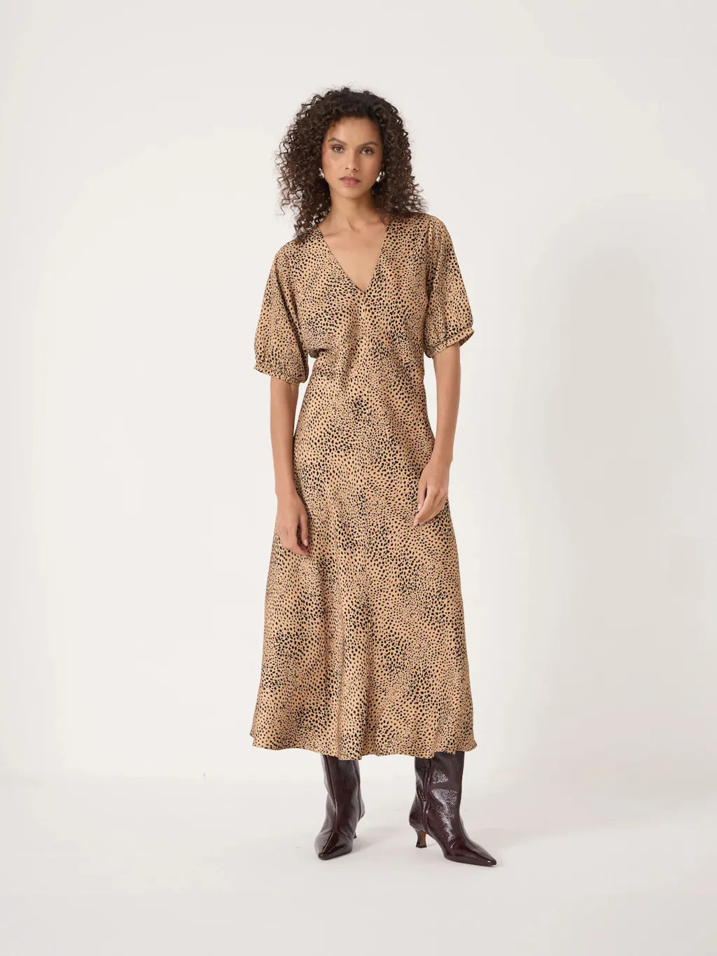 Beige v-neck midaxi dress with black spot print.