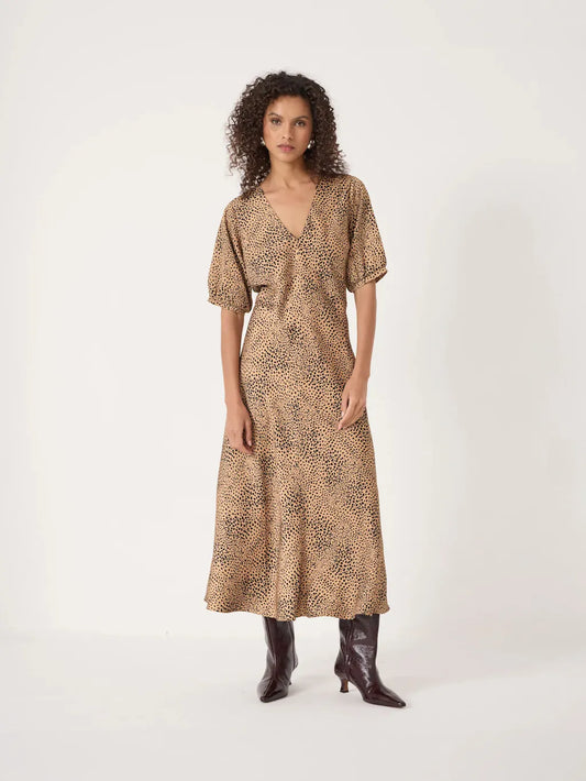 Beige v-neck midaxi dress with black spot print.