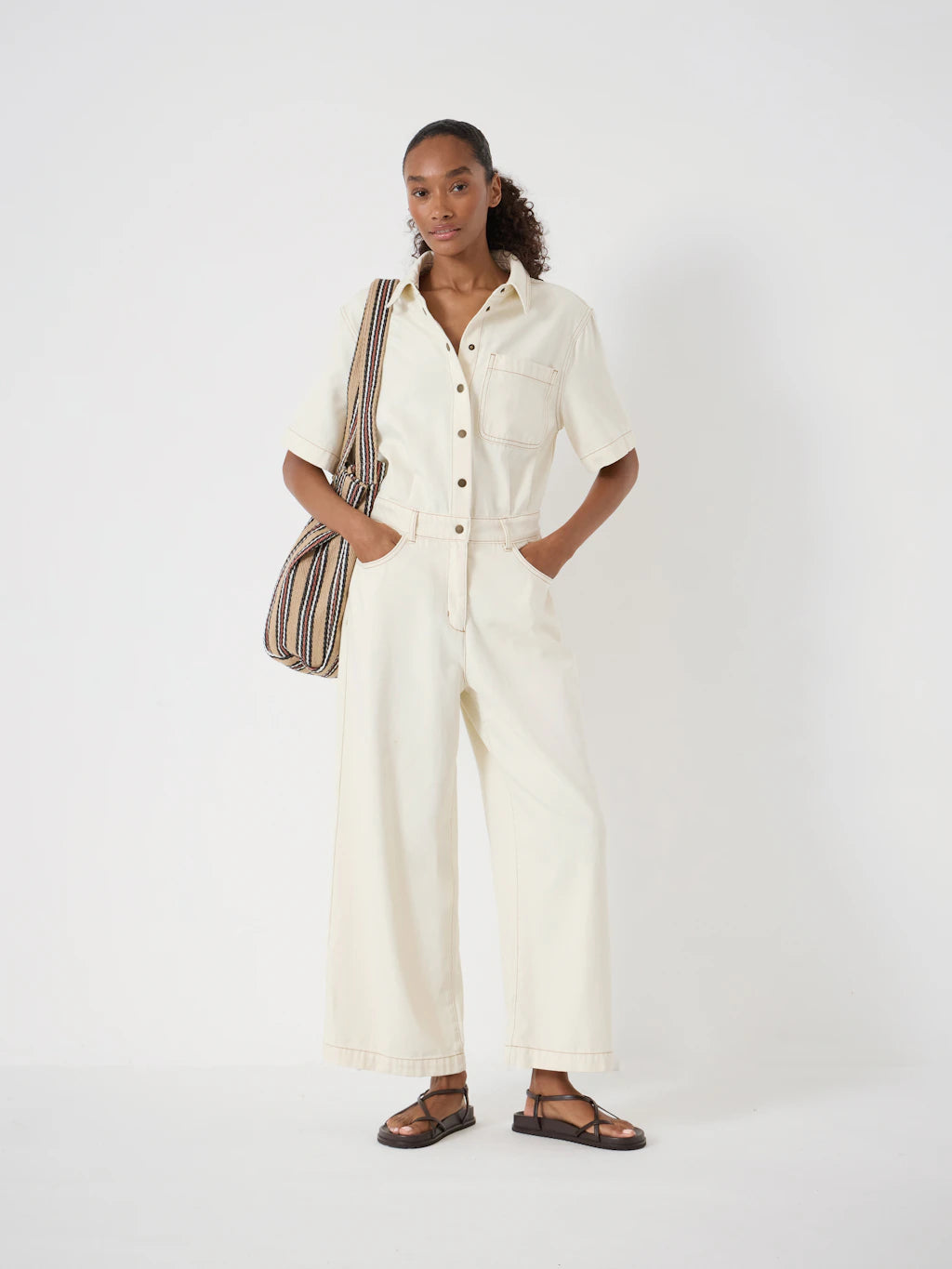 Ecru denim jumpsuit.