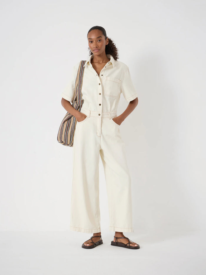 Ecru denim jumpsuit.