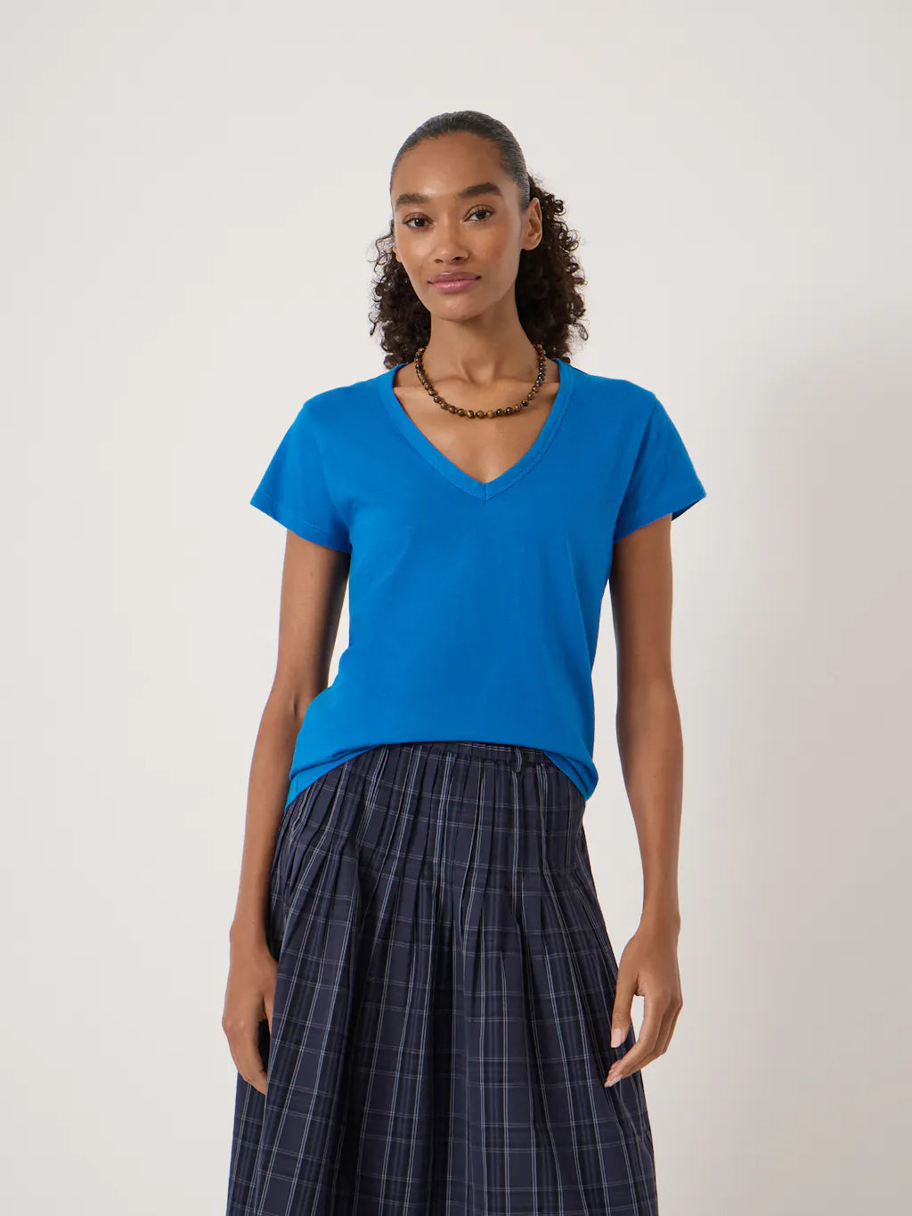 Bright blue 100% cotton V-neck T-shirt in a smooth jersey fabric with short sleeves and a relaxed fit.