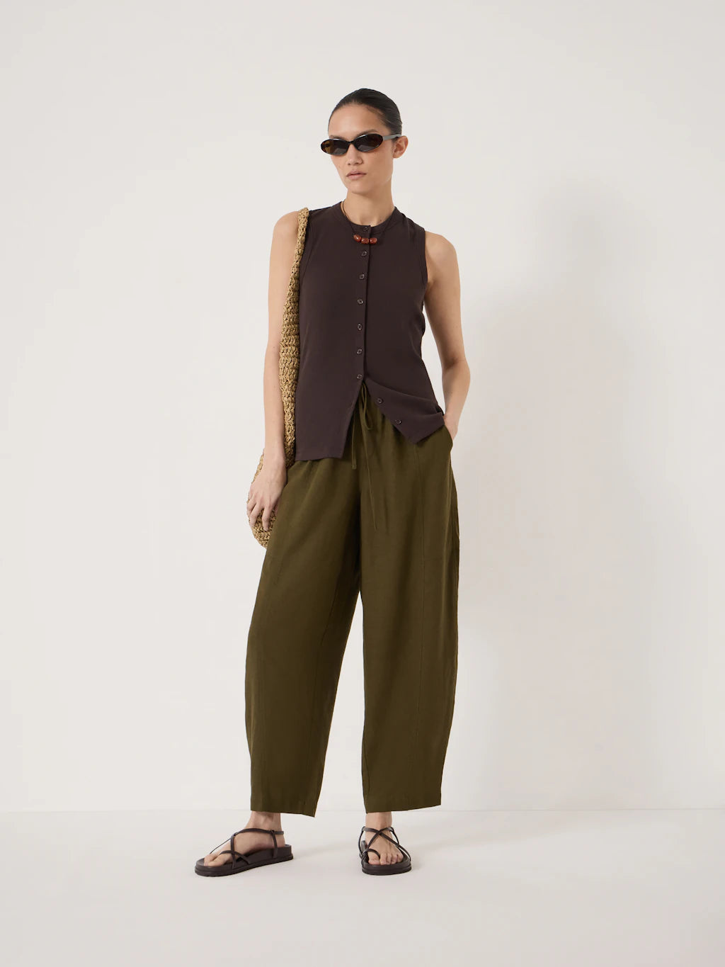 Deep olive barrel leg linen-blend trousers.