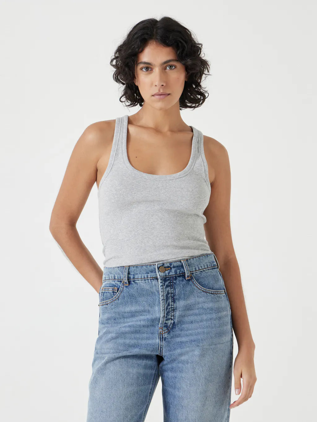 Light grey ribbed tank top with a scoop neckline and slim fit.