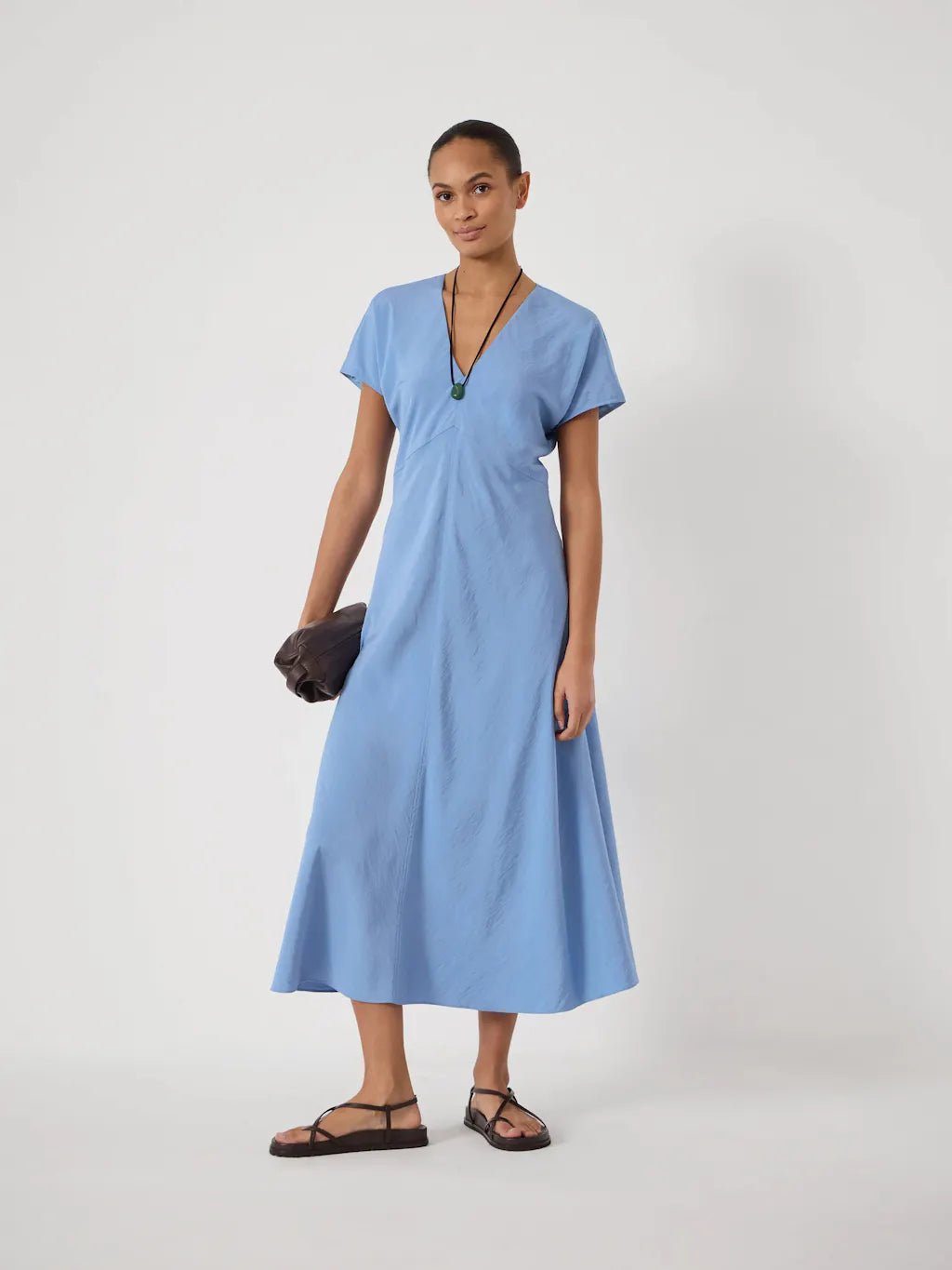 Light blue v-neck dress.