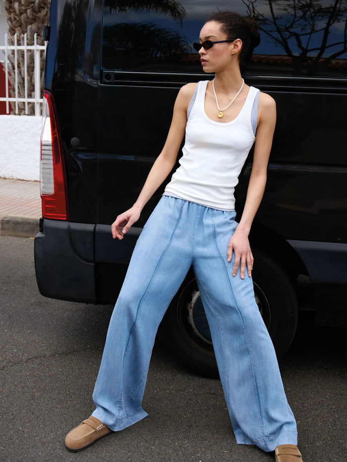 Light blue chambray wide leg trousers.