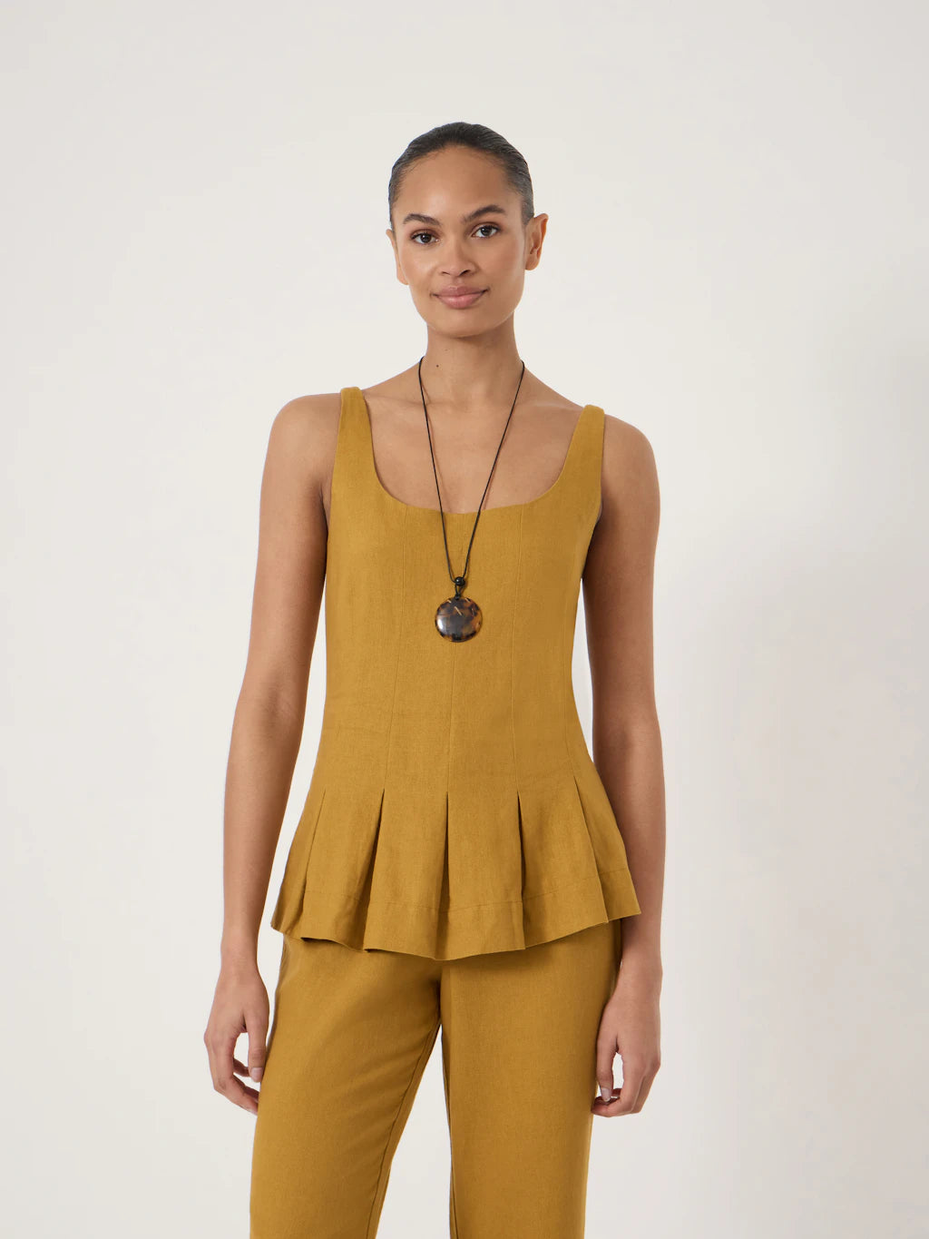 Mustard yellow linen blend waisted top.